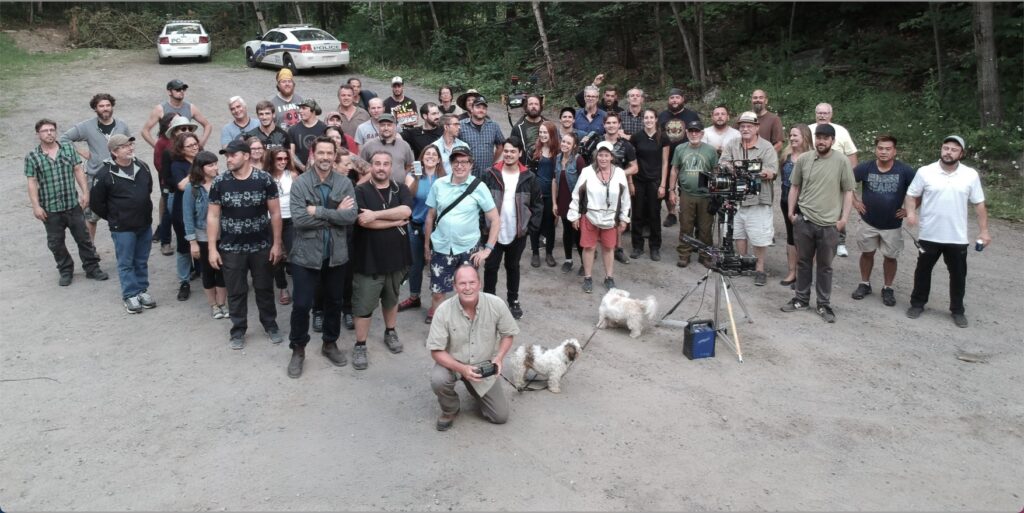 Film crew photo from the TV series Cardinal in North Bay, featuring generator operator John Irwin (GennyJohn) in the foreground