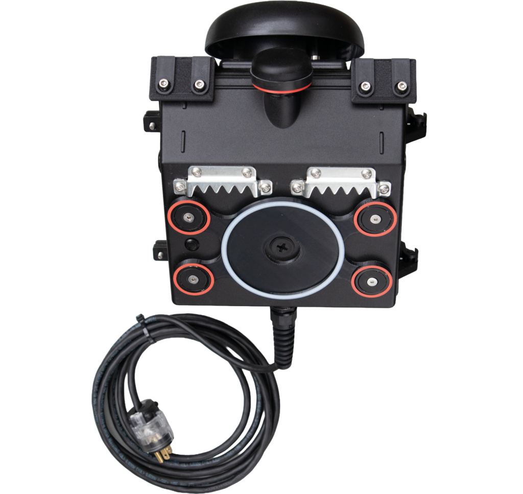 Back view of the PortaBell wall-mounted bell and light unit showing the mounting side, sawtooth hanging brackets, magnetic mounting points, permanent mounting point, bell, antenna, power cord, and plug.