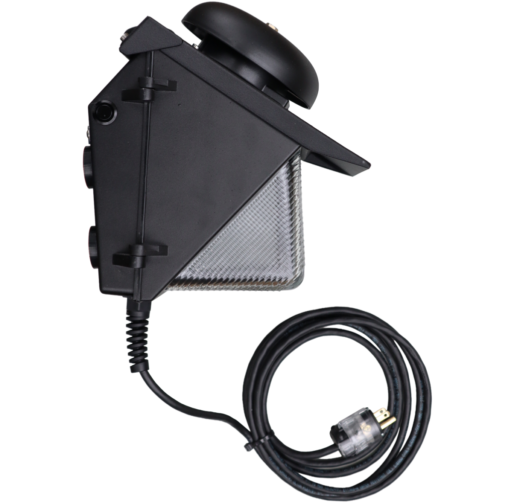 PortaBell wall-mounted bell and light unit for film and television production sets, showing the black housing, warning light lens, bell, power cord, and plug.